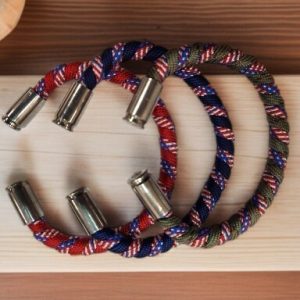 Copper wrapped with parachute cord and finished with 9mm casings.